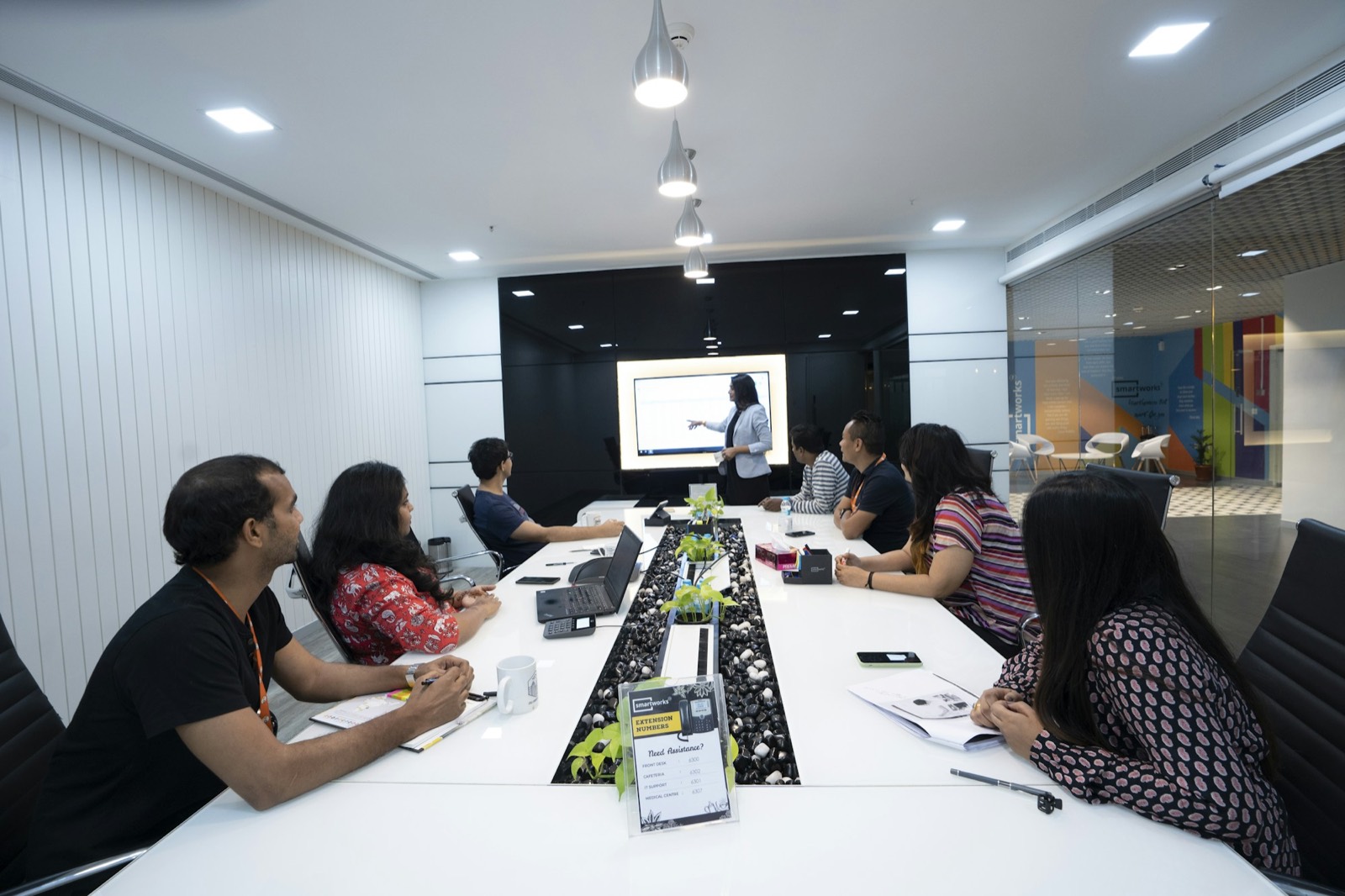 Engineering team in a meeting room reviewing a migration plan