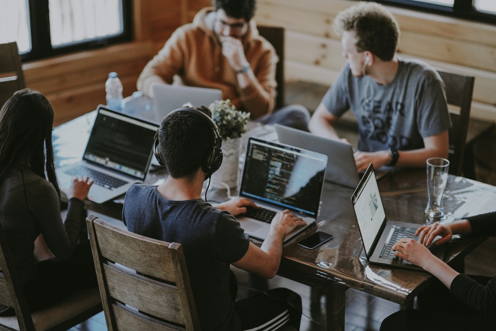 Migration engineers working together around a table