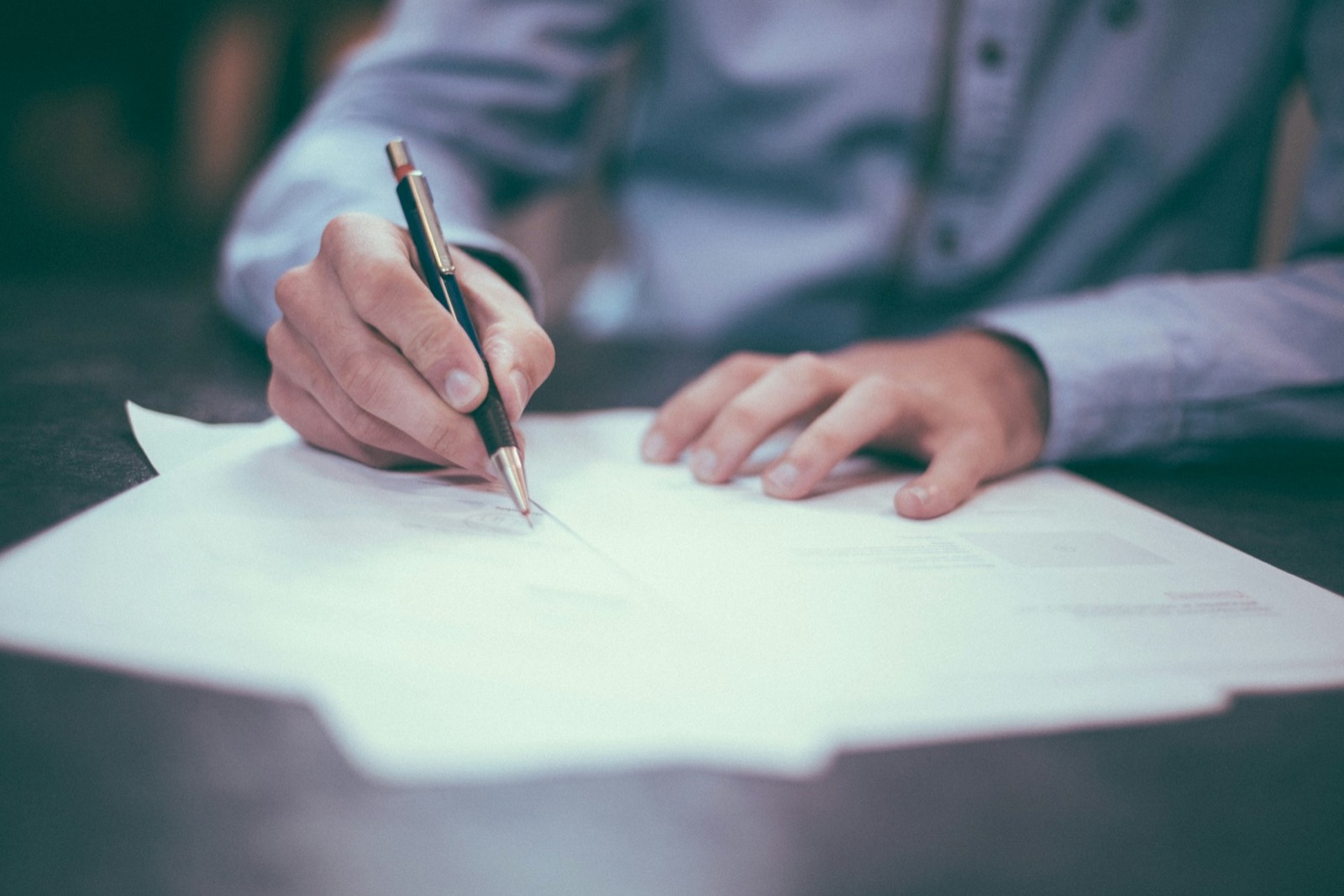 Insurance policy documents being signed